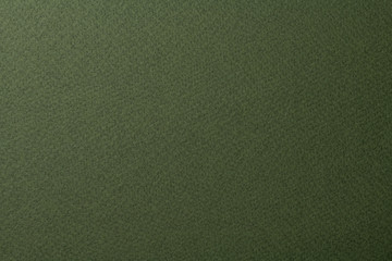 オリーブグリーンの質感のある紙の背景テクスチャー