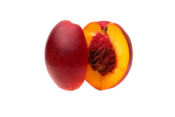 Halves of the Peach or nectarine with cut pieces on white background