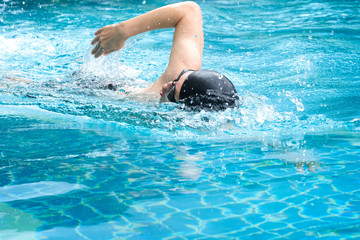 Women swim in a freestyle swimming style that is standard swimming.