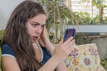 worried woman making mistakes on a phone