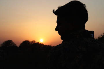 silhouette of a man in sunset