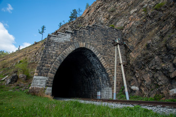 Old tunnel on Circum-Baikal Railway, lake Baikal. 
Baikal. View from one tunnel to other tunnel. Circum-Baikal Railway. Irkutsk region.