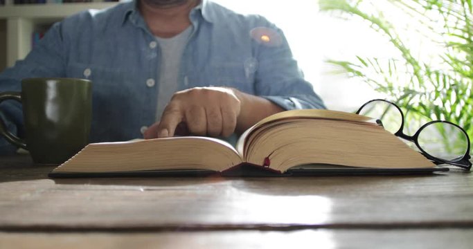 reading book with coffee cup