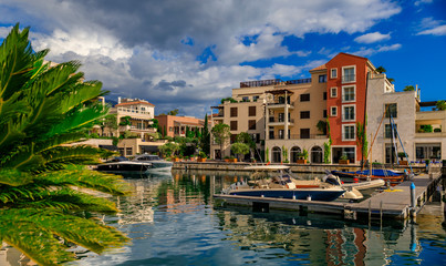 Scenic view of the Adriatic Sea and luxury residential buildings and boats in the background in the summer in Tivat, Montenegro