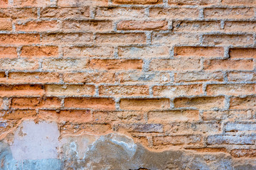 decayed old concrete wall  with red brick