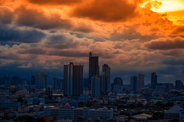 The high angle background of the city view with the secret light of the evening, blurring of night lights, showing the distribution of condominiums, dense homes in the capital community