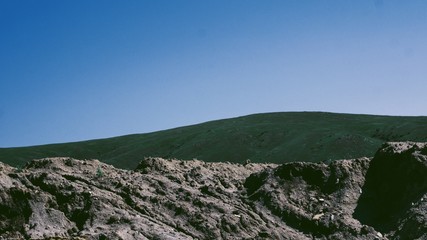 Mountain against the sky at noon in the summer at the quarry.