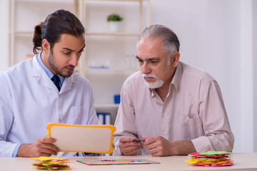 Doctor and patient suffering from Alzheimer disease