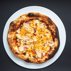 pizza on the black background, top view