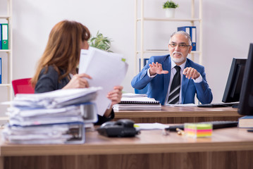 Two employees working in the office