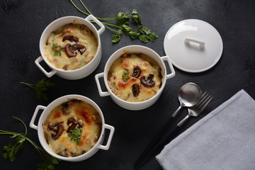 Julienne with chicken and mushrooms with a golden crust ,  baked cheese