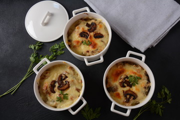 Julienne with chicken and mushrooms with a golden crust ,  baked cheese