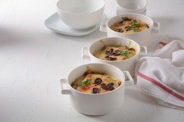 Julienne with chicken and mushrooms with a golden crust ,  baked cheese