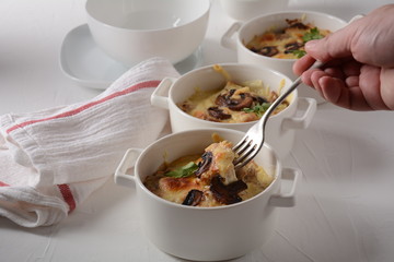 Julienne with chicken and mushrooms with a golden crust ,  baked cheese