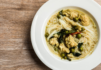 Thai rice noodles with green curry in plate, Thai street food