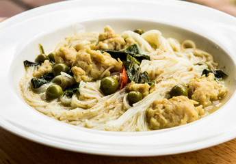 Thai rice noodles with green curry in plate, Thai street food