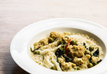 Thai rice noodles with green curry in plate, Thai street food