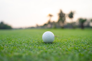 A golf ball placed on a golf course on soft grass
