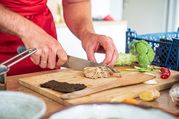 chef making ramen with chicken