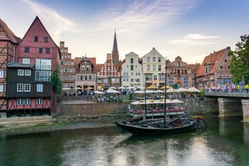view of the river and the historic old city center of Luneburg in northern Germany