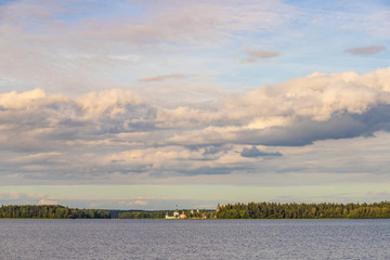 Landscape of Valdai lake with a Christian church located on the opposite bank