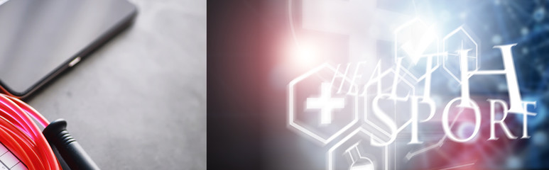 Obraz premium Jump rope. Physical education. Sports exercise equipment. Rope exercises routine. Pink jump rope phone with a stopwatch and water on the table.