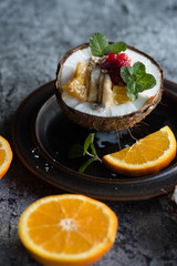 Smoothie bowl with colorful tropical fruits. Summer healthy diet, vegan breakfast.
