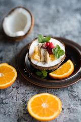 Smoothie bowl with colorful tropical fruits. Summer healthy diet, vegan breakfast.
