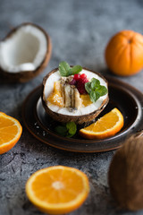 Smoothie bowl with colorful tropical fruits. Summer healthy diet, vegan breakfast.