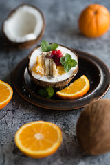Smoothie bowl with colorful tropical fruits. Summer healthy diet, vegan breakfast.