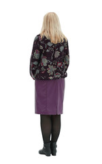 old woman in full growth stands with her back on a white backgro