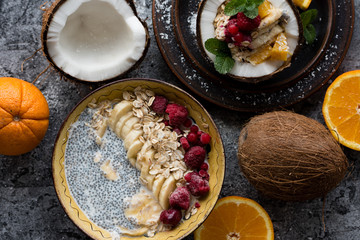 Smoothie bowl with colorful tropical fruits. Summer healthy diet, vegan breakfast.