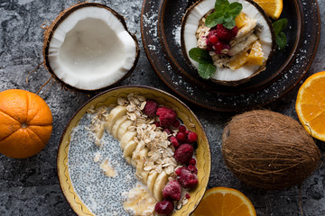 Smoothie bowl with colorful tropical fruits. Summer healthy diet, vegan breakfast.