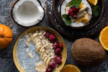 Smoothie bowl with colorful tropical fruits. Summer healthy diet, vegan breakfast.