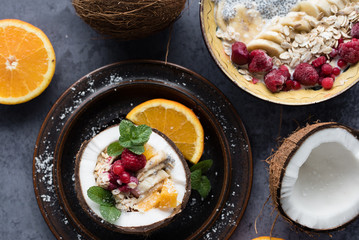 Smoothie bowl with colorful tropical fruits. Summer healthy diet, vegan breakfast.