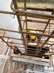 KUALA LUMPUR, MALAYSIA -MARCH 05, 2020: Construction workers installing & fabricating timber formwork at the construction site. The formworks made from timber and plywood. 