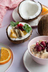 Overhead view of oatmeal with chia seed, .raspberries, bananas and oranges