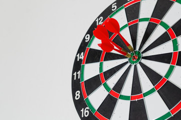 Success goals Targeting the business concept. Businessman throwing red arrow dart to virtual target...