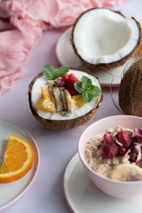 Overhead view of oatmeal with chia seed, .raspberries, bananas and oranges
