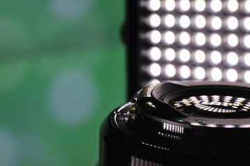 Equipment videographer and photographer. Lenses on the table against the background of bright...