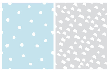 Simple Pastel Color Geometric Seamless Vector Patterns. White Irregular Hand Drawn Doodle Print. Infantile Style Abstract Backdrop with White Spots and Dots Isolated on a Light Blue and Gray Backgroun