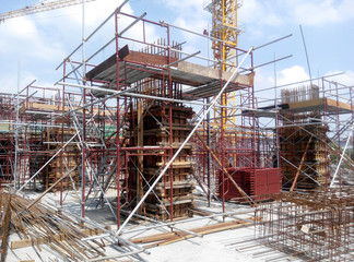 KUALA LUMPUR, MALAYSIA -MARCH 13, 2020: Column timber form work and reinforcement bar at the construction site. Installed by construction workers. The structure supported by temporary wood support.