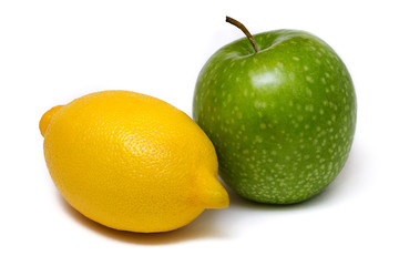 Green apple and lemon isolated on white background