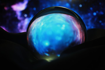 Astrological background. Crystal ball with predictions. Horoscope of the stars. Fortune telling and determination of fate. Soothsayer with a crystal ball.
