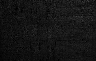Black linen old fabric texture or background.