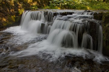 Fototapeta na wymiar Mohelnice waterfall, small river Mohlenice, Beskydy mountains, Czech Republic