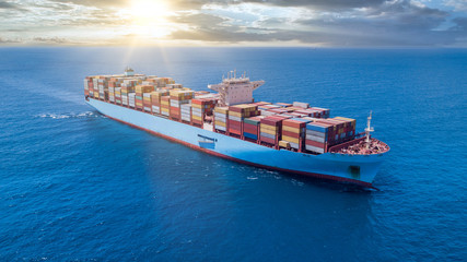 Ultra-large container vessel or ULCV fully loaded with freight Container.