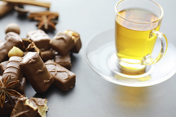 Chocolate bars on a black background in backlight. Chocolate with filling. Sweet sweets for snack and tea.