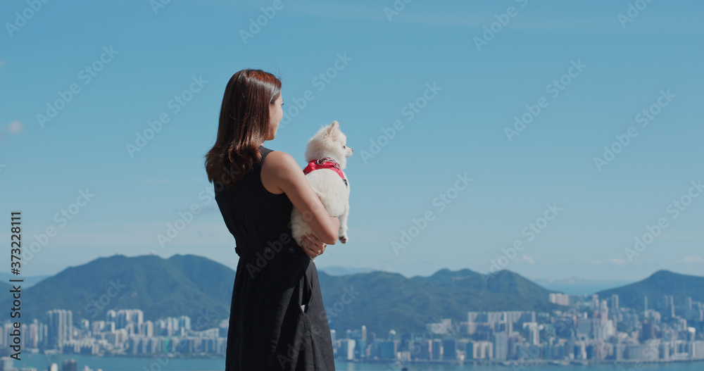 Poster Woman go out with her dog at park