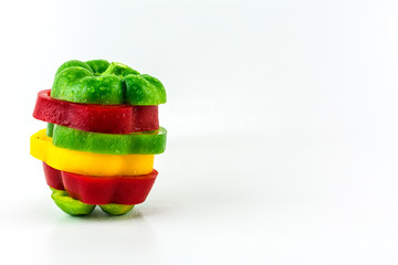 Sweet pepper on a white background./ Three colorful fresh yellow, red, green sweet pepper.